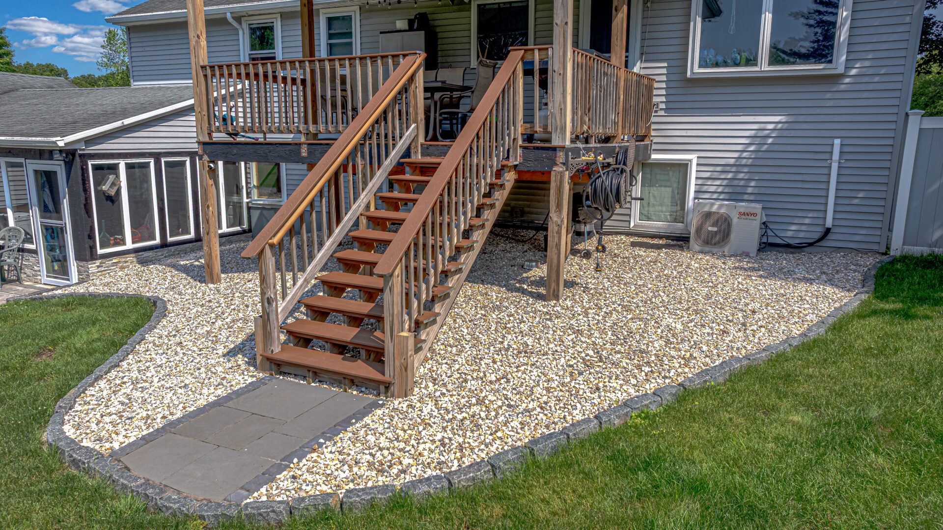 Decorative gravel bed with paver accents and stone edging—installed by HQ Landscaping in Southington CT